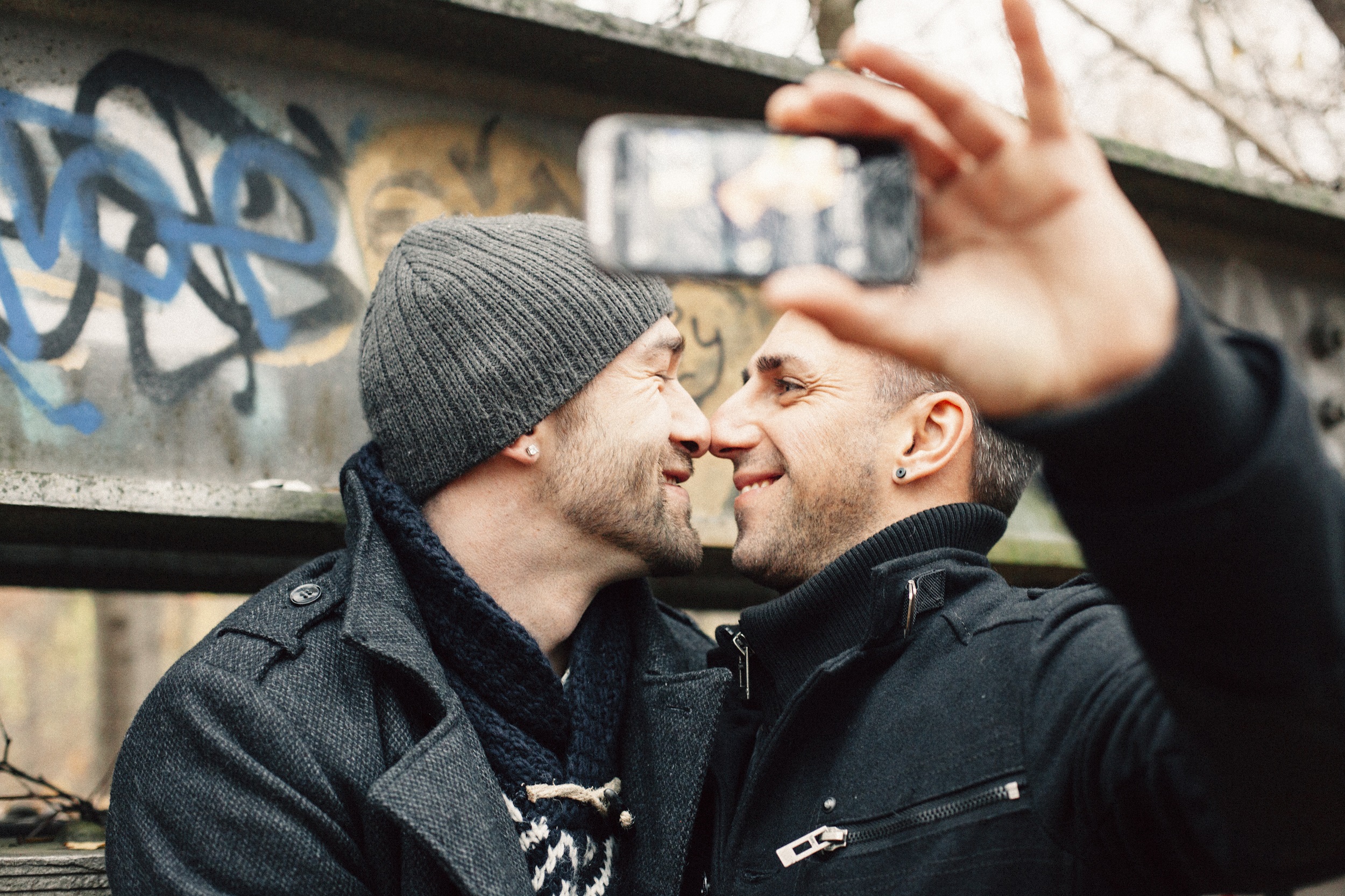 handsome gay couple photographing a selfie