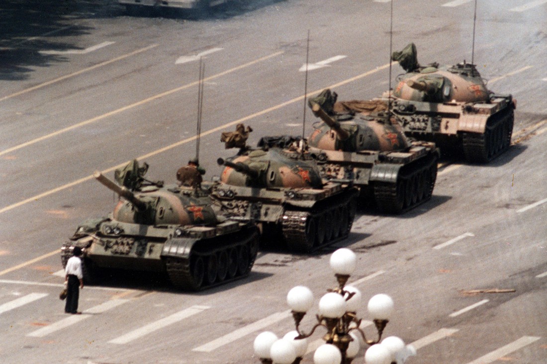 FILE - In this June 5, 1989 file photo, a Chinese protestor blocks a line of tanks heading east on Beijing's Cangan Blvd. June 5, 1989 in front of the Beijing Hotel. The man, calling for an end to the violence and bloodshed against pro-democracy demonstrators, was pulled away by bystanders, and the tanks continued on their way. Thursday June 4, 2009 marks the 20th anniversary of the Chinese military assault on demonstrators on the night of June 3-4, 1989 in Tiananmen Square. (AP Photo/Jeff Widener, File)